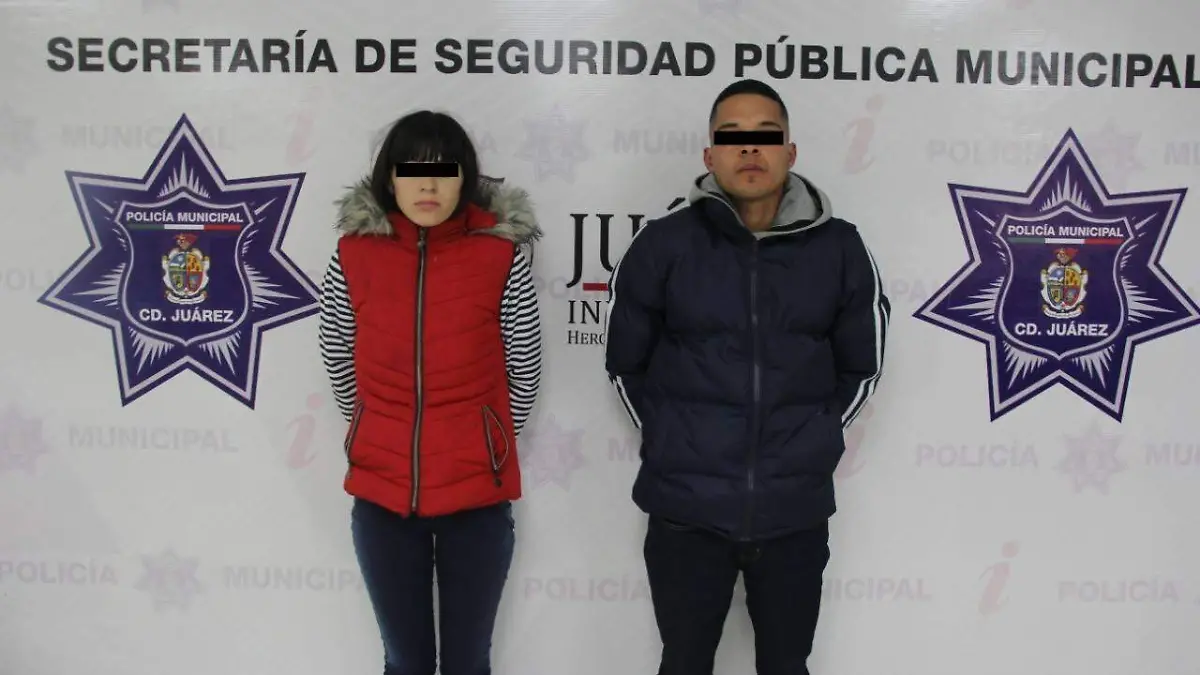 pareja detenida robando